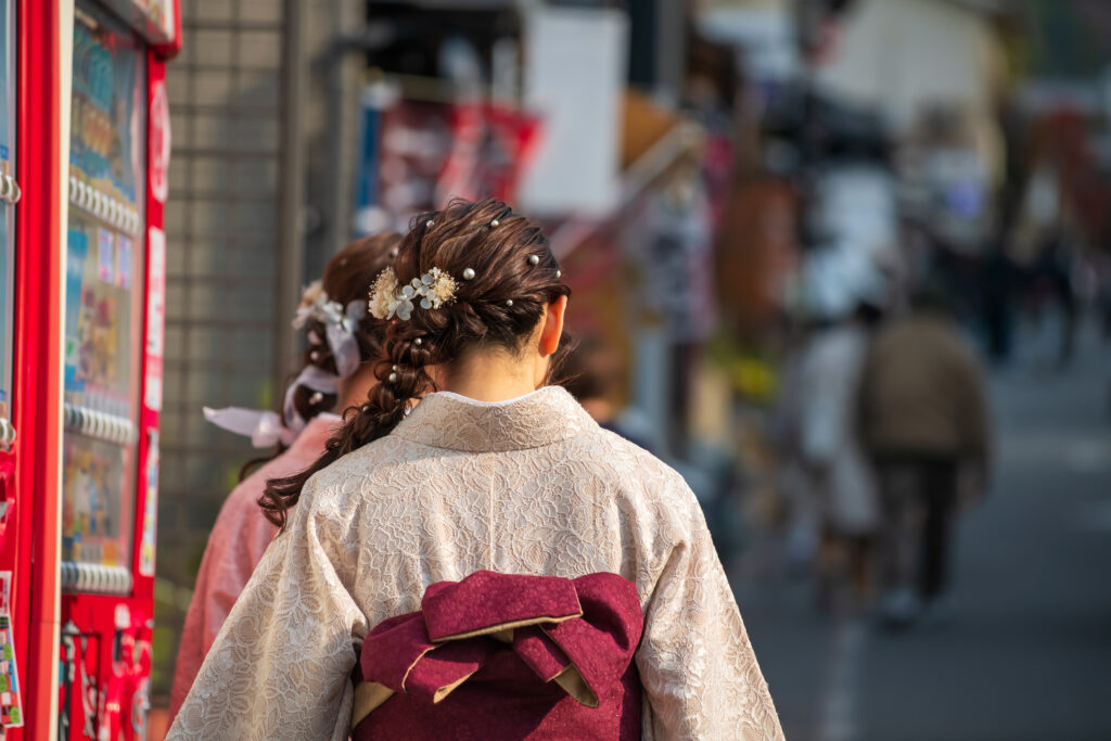 A group of young girls dressed in colorful rented kimonos walk cheerfully up the steep, picturesque streets leading to Kiyomizu-dera Temple